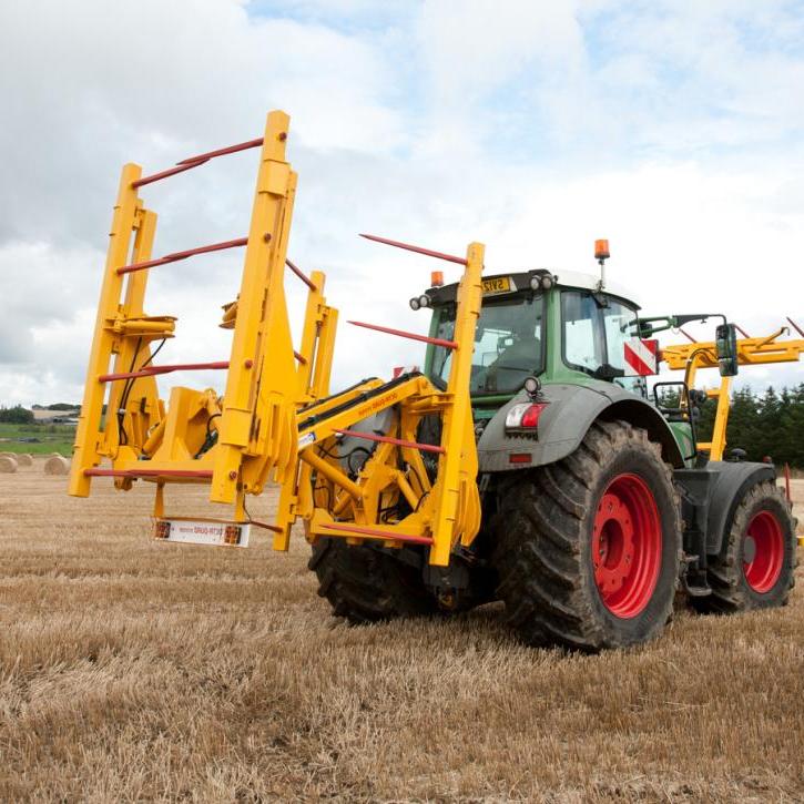 cta-Quad Bale Handling System - front and rear sections for carrying 12 round bales or 6 Heston bales at a time. Showing the hydraulic folding version.